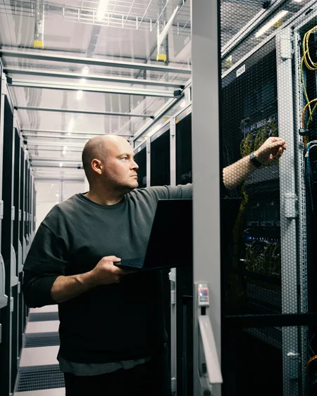 Technician working on systems in the data centre